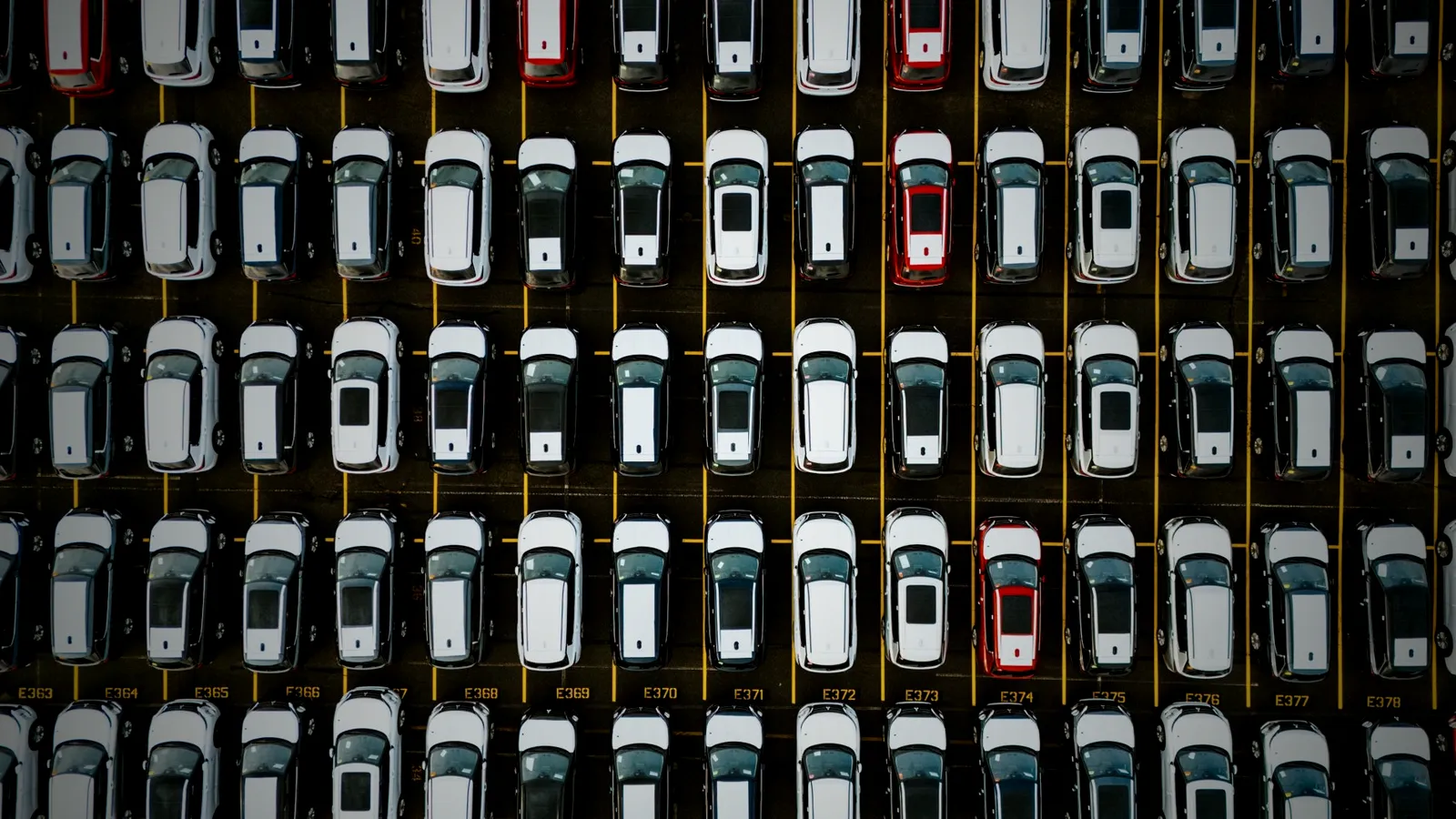 Aerial view of rows of cars in a large lot